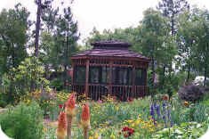 Gazebo with red hot pokers