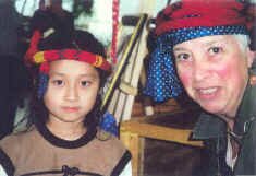 Chinese-American girl models one of Naomi's hand made worm hats. (photo by Ron Bloom)